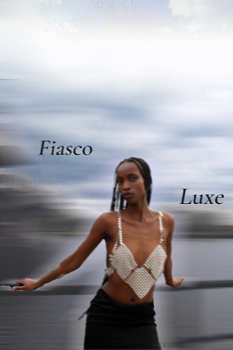 Cover photo for Fiasco Luxe project. Model is standing by a river whilst wearing one of the clothing pieces from the project.